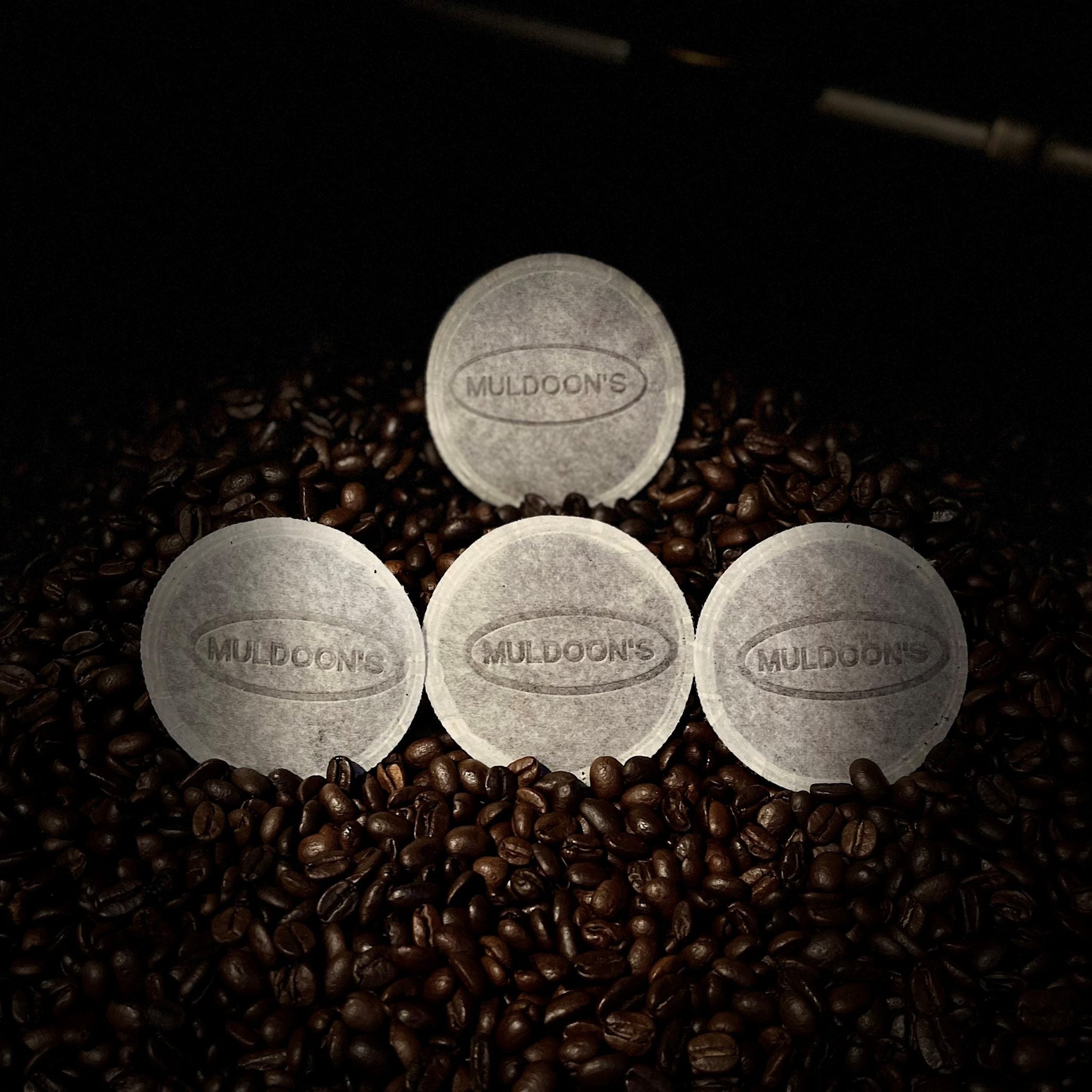 Muldoon's Singles on top of roasted coffee