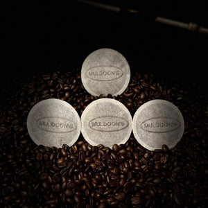 Muldoon's Singles on top of roasted coffee